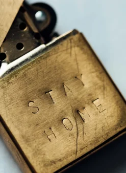 Women Imogene + Willie hand stamped “stay home” zippo